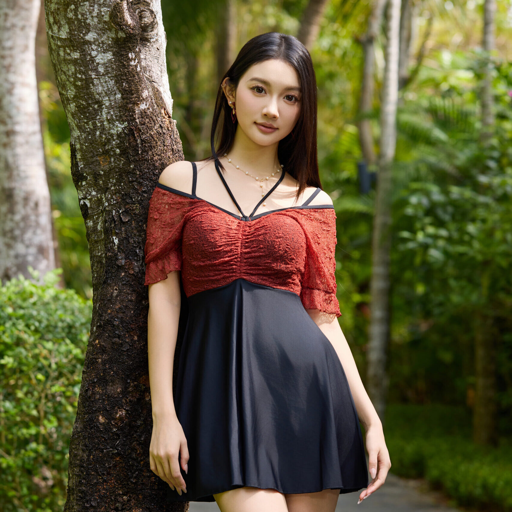 A one-piece lace dress with adjustable shoulder straps