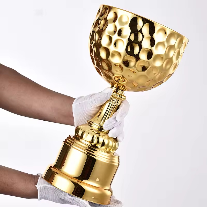 The Golden Trophy Factory supplies sports commemorative trophies - large metal gold and silver trophies, Golden Globe Awards, and special trophies for football and bowling events